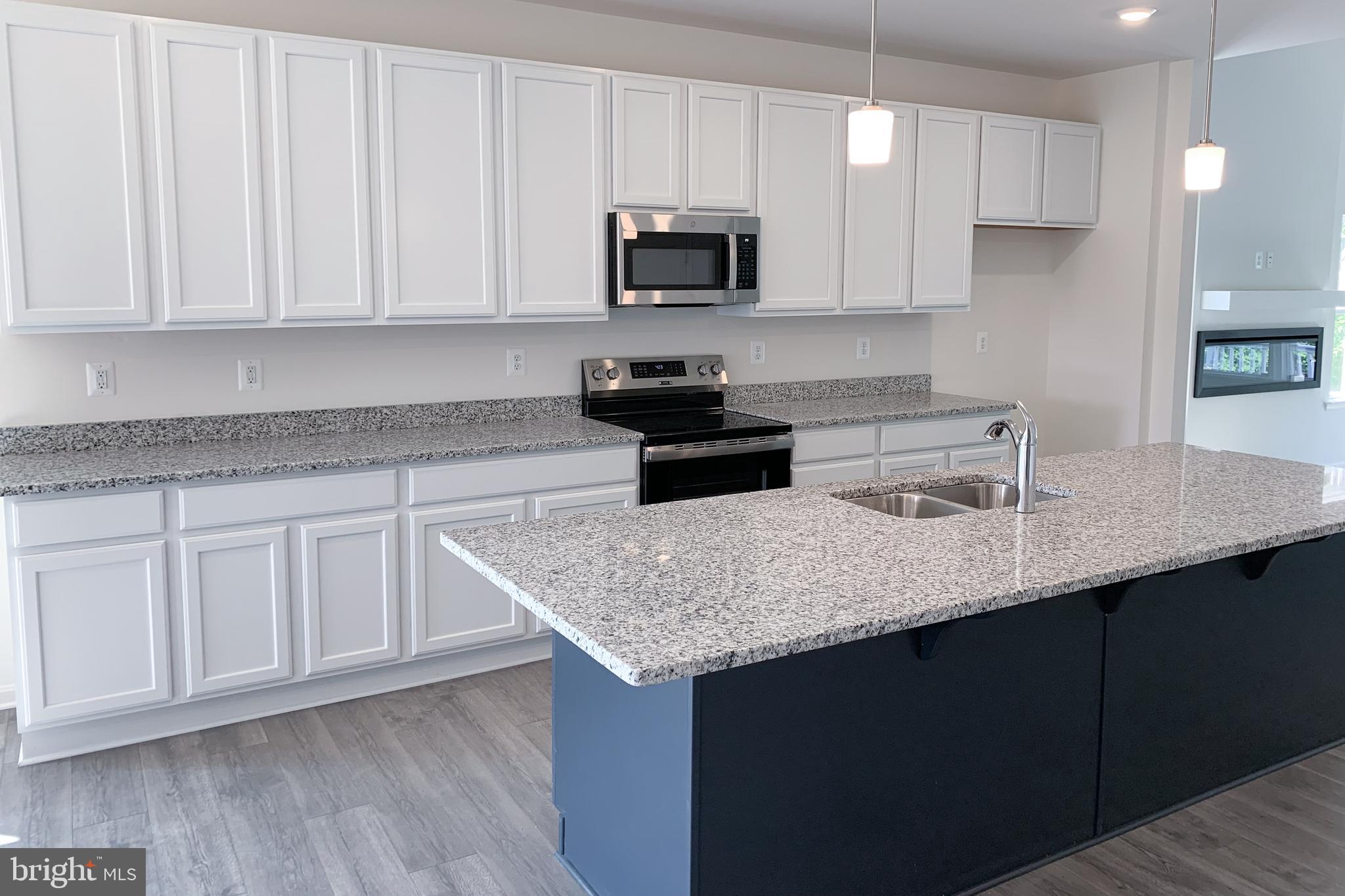 Tbd Tbd Nell Street Perryville, MD 21903 - Photo 7 of 13 a kitchen with stainless steel appliances granite countertop a sink dishwasher a stove and a microwave oven on granite countertops