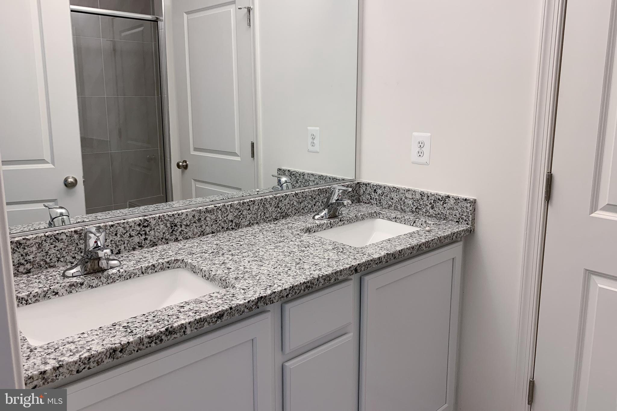 Tbd Tbd Nell Street Perryville, MD 21903 - Photo 9 of 13 a bathroom with a granite countertop sink and a mirror