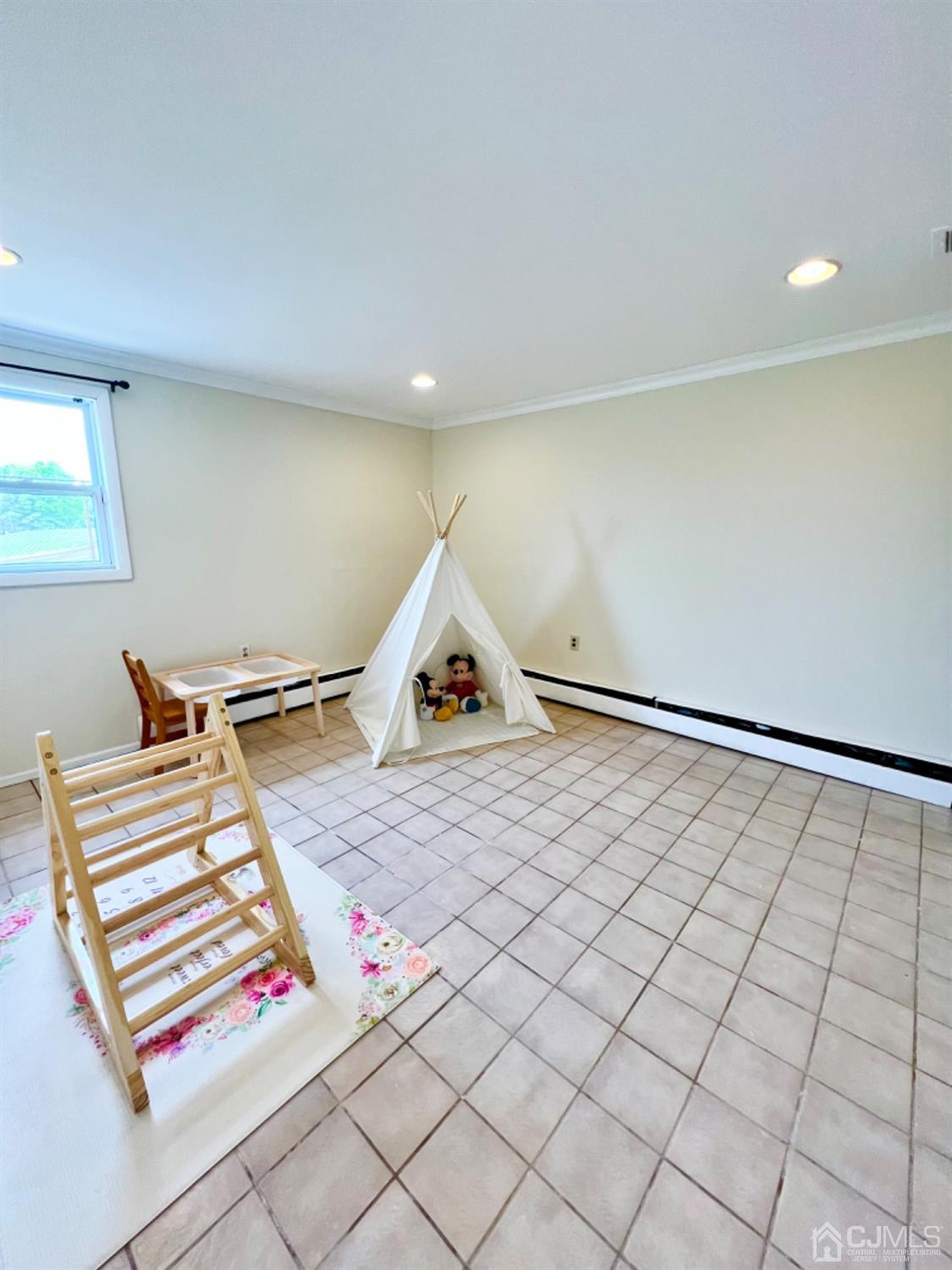 24 Sims Road Edison, NJ 08817 - Photo 13 of 16 a bedroom with a bed and a window