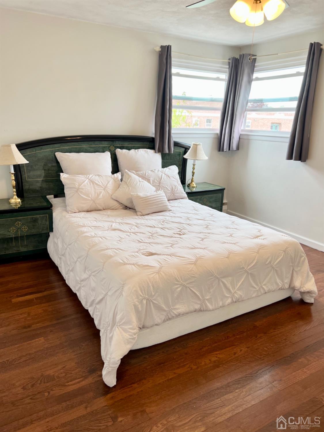 24 Sims Road Edison, NJ 08817 - Photo 8 of 16 a large bed sitting in a bedroom next to a window
