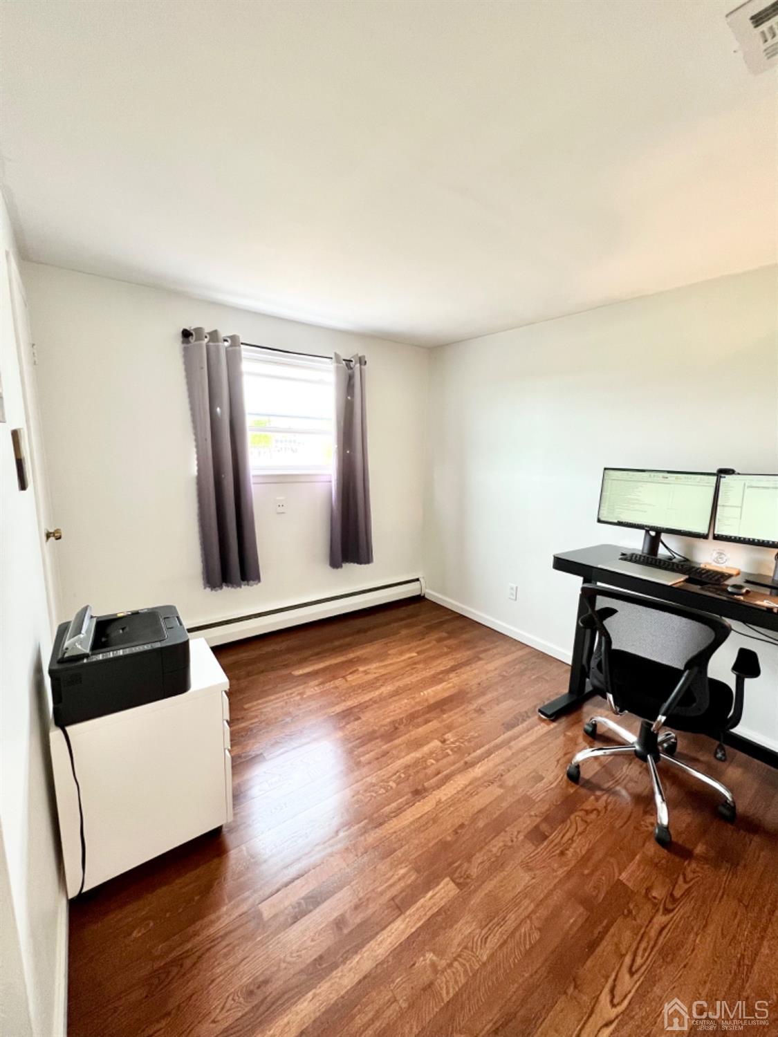 24 Sims Road Edison, NJ 08817 - Photo 10 of 16 a living room with wooden floor and furniture