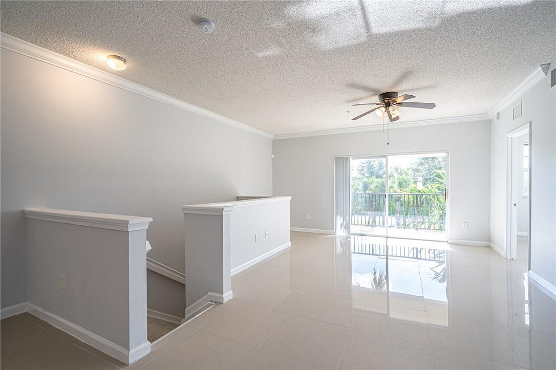 5860 West Sample Road, Unit 304 Coral Springs, FL 33067 - Photo 1 of 22 a view of an empty room with a window