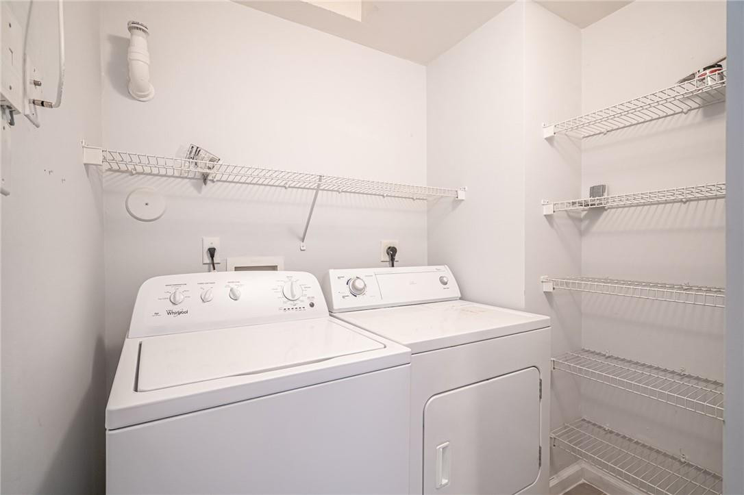 5860 West Sample Road, Unit 304 Coral Springs, FL 33067 - Photo 19 of 22 a utility room with dryer and washer