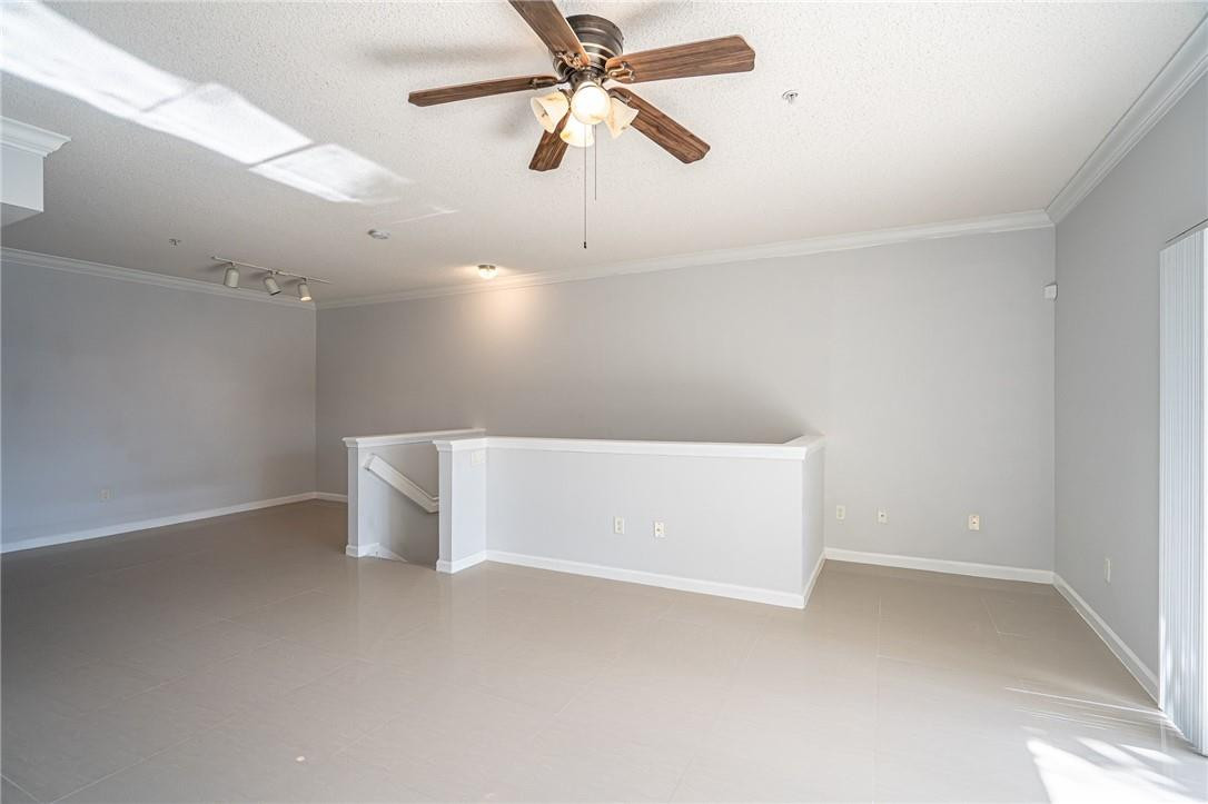 5860 West Sample Road, Unit 304 Coral Springs, FL 33067 - Photo 2 of 22 a view of an empty room