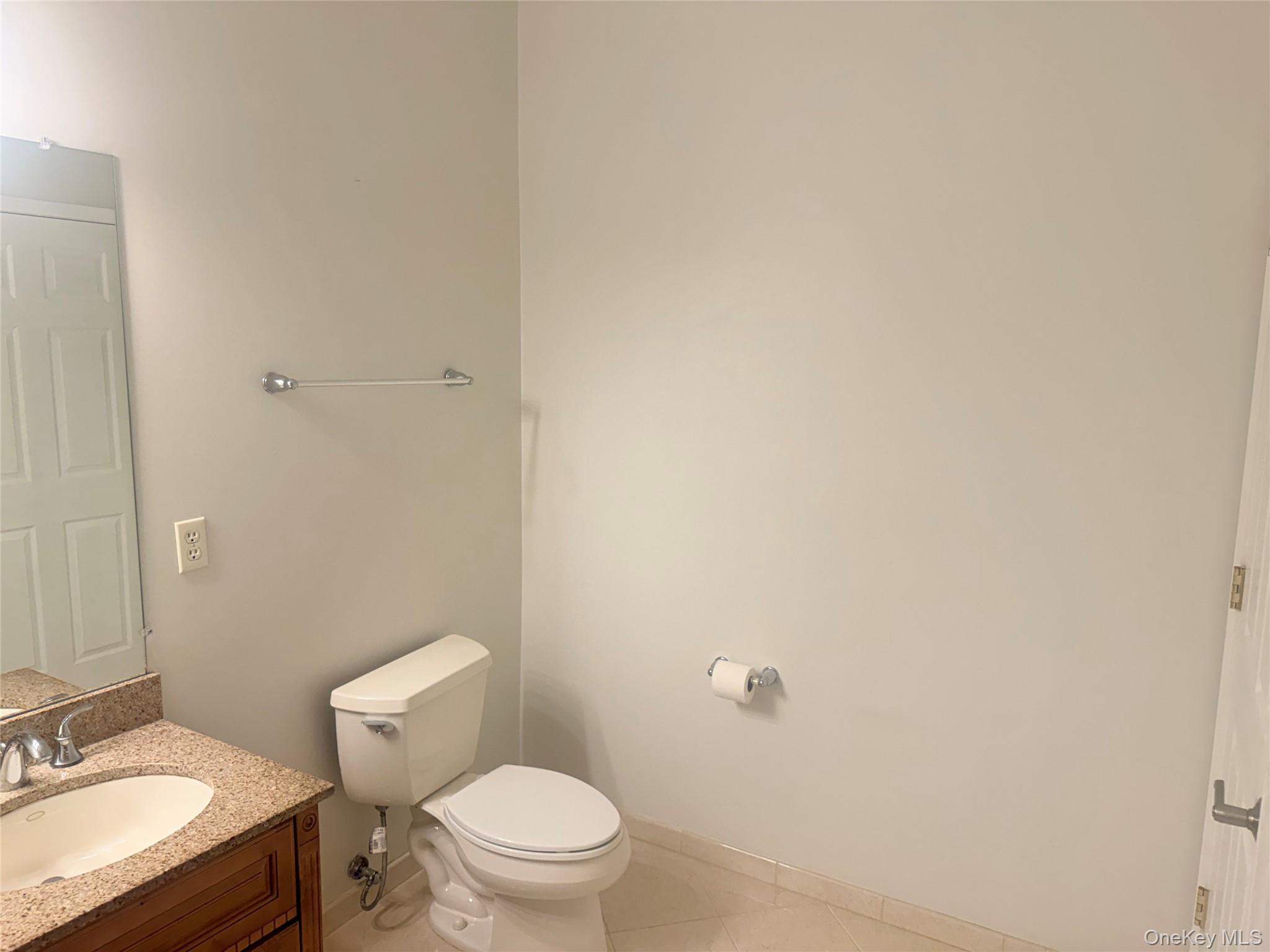 935 Tower Ridge Circle Middletown, NY 10941 - Photo 9 of 24 Bathroom featuring a vanity with a light-colored countertop, an undermount sink, and chrome fixtures