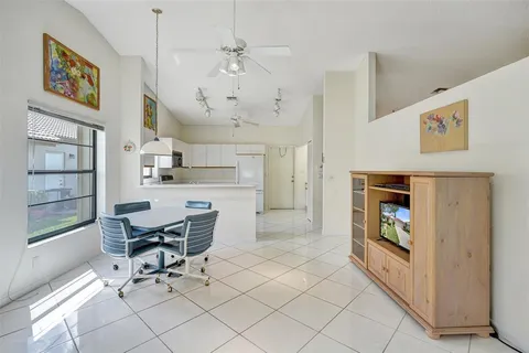 a view of a livingroom with furniture and a kitchen