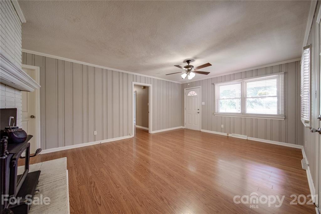 3802 Austin Road Monroe, NC 28112 - Photo 14 of 43 wooden floor in an empty room with a window