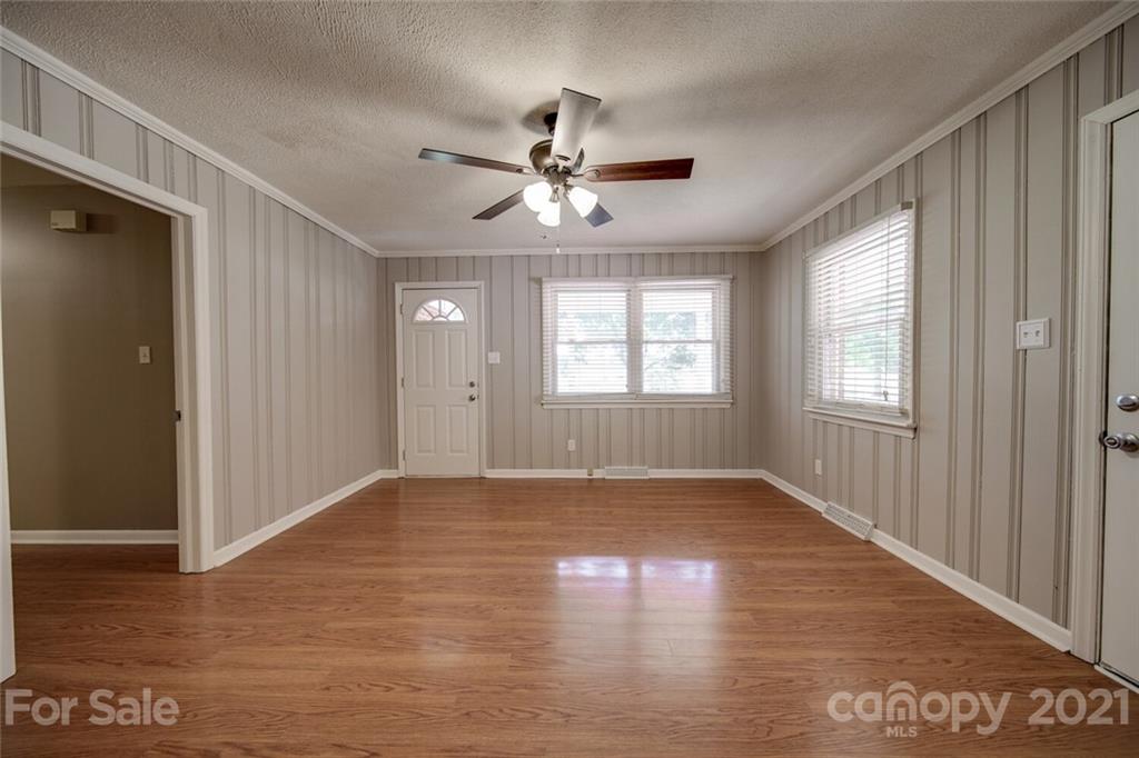 3802 Austin Road Monroe, NC 28112 - Photo 17 of 43 a view of an empty room with wooden floor and a window