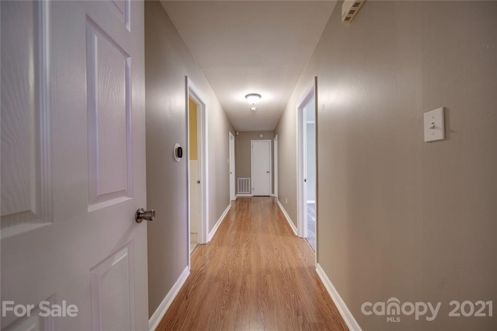 3802 Austin Road Monroe, NC 28112 - Photo 18 of 43 a view of a hallway with wooden floor