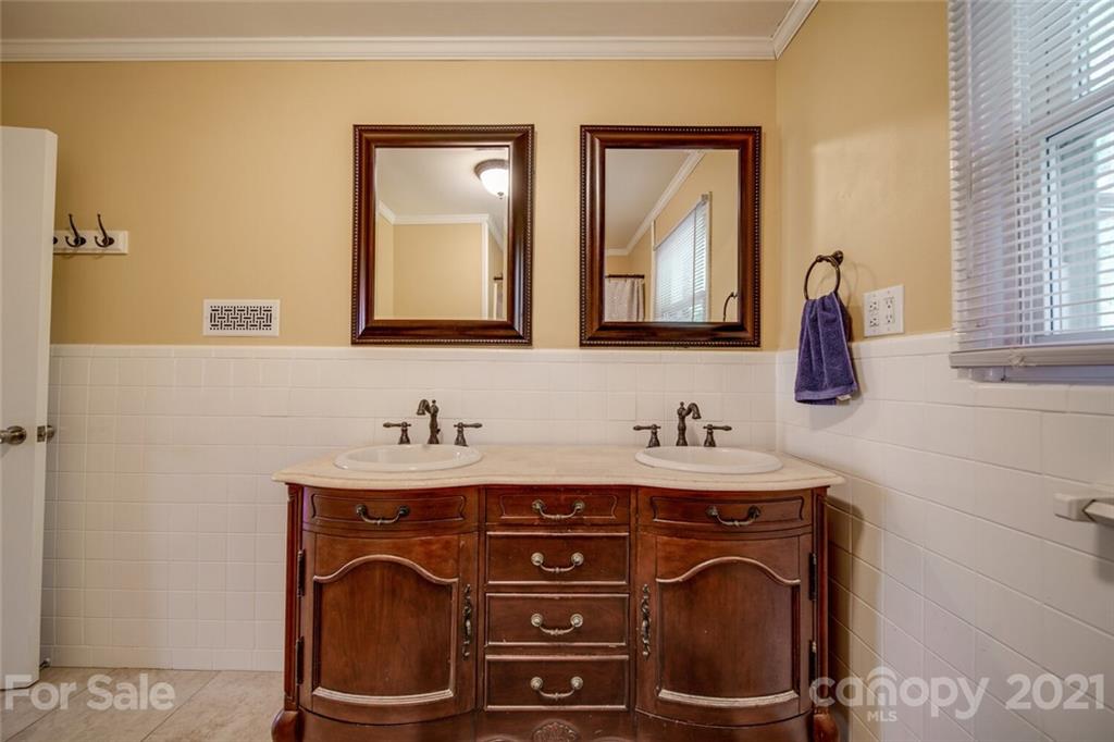3802 Austin Road Monroe, NC 28112 - Photo 19 of 43 a bathroom with a sink and a mirror