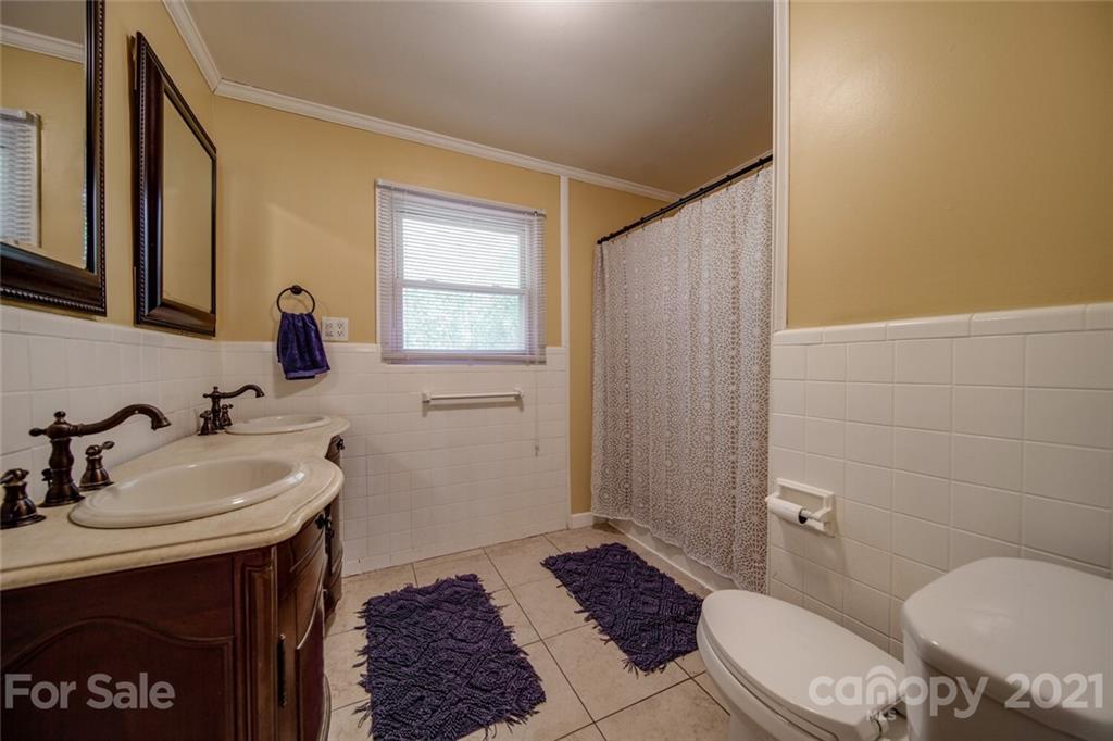 3802 Austin Road Monroe, NC 28112 - Photo 20 of 43 a bathroom with a sink and a mirror