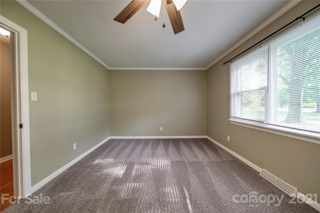 3802 Austin Road Monroe, NC 28112 - Photo 22 of 43 wooden floor in an empty room with a window