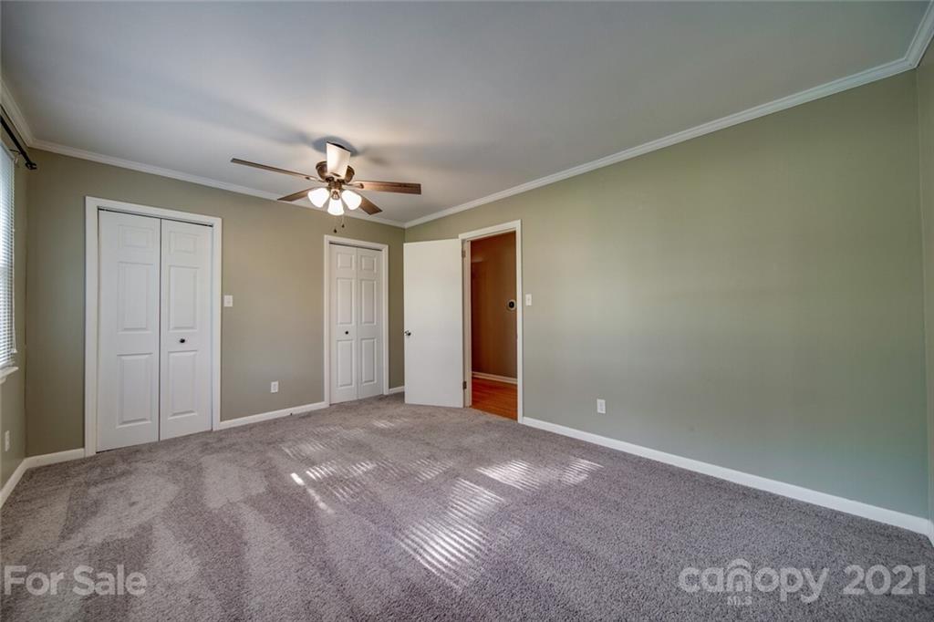 3802 Austin Road Monroe, NC 28112 - Photo 24 of 43 a view of a room with a ceiling fan and a window
