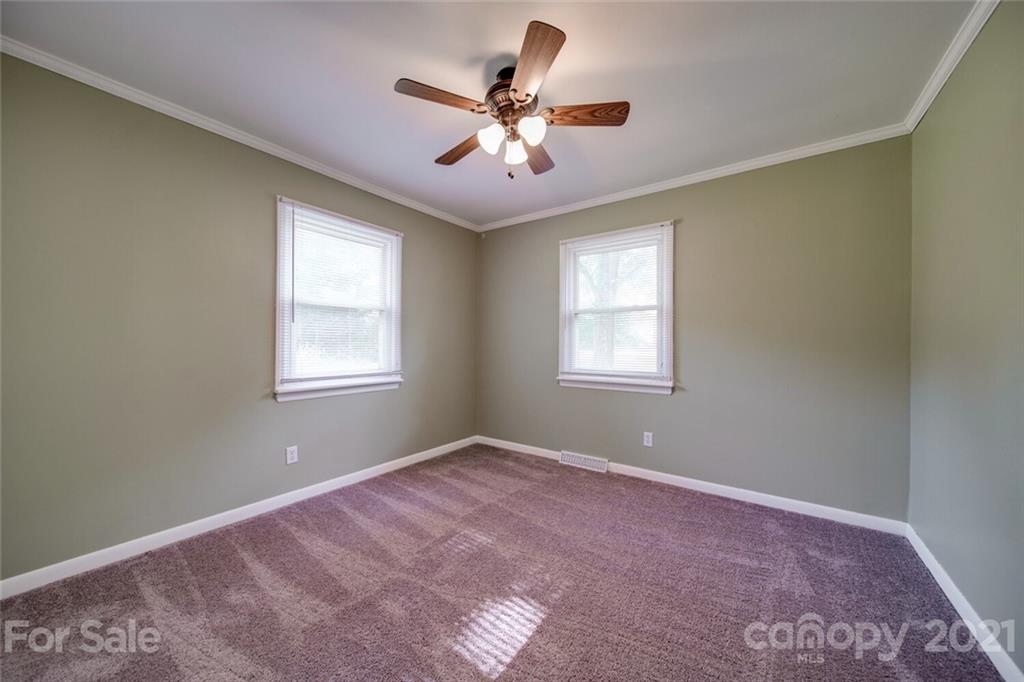 3802 Austin Road Monroe, NC 28112 - Photo 27 of 43 a view of a livingroom with a ceiling fan and window