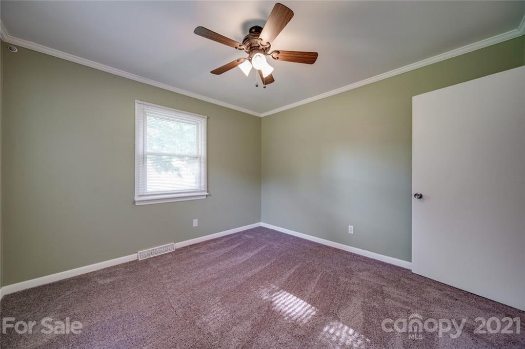 3802 Austin Road Monroe, NC 28112 - Photo 28 of 43 a view of a room with a ceiling fan and a window