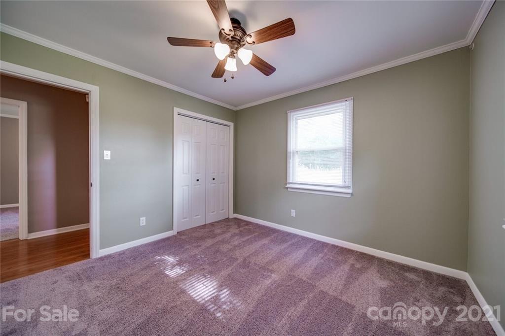 3802 Austin Road Monroe, NC 28112 - Photo 31 of 43 a view of a big room with windows and ceiling fan