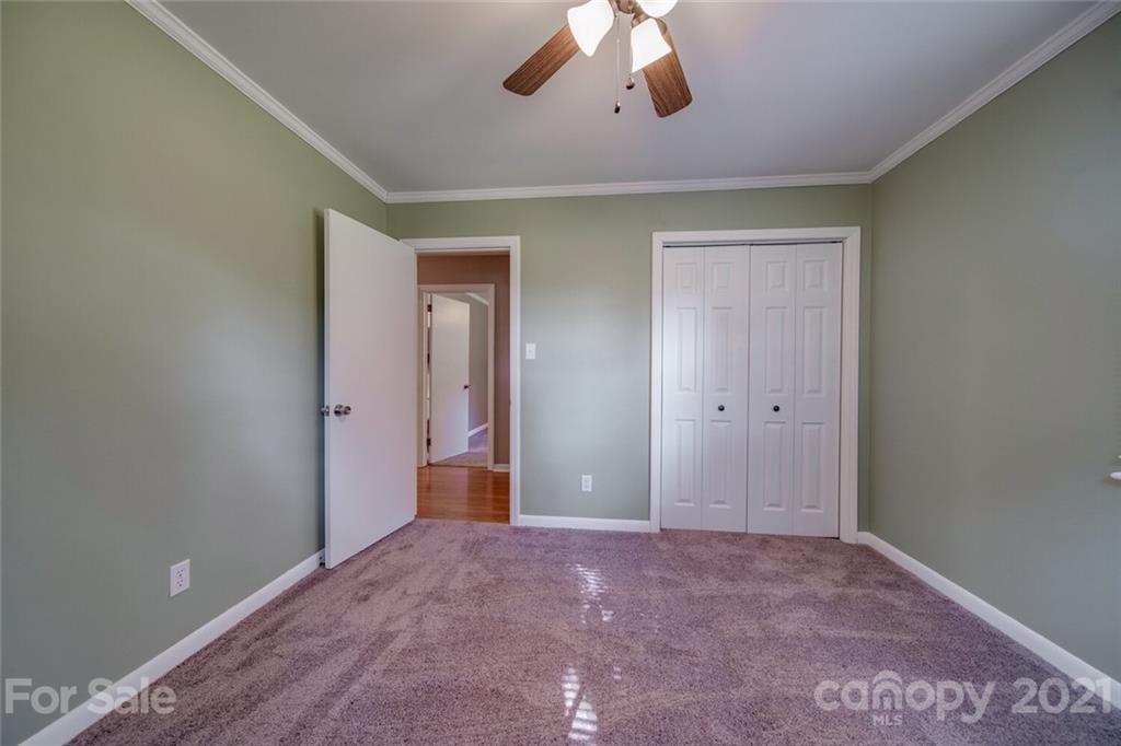 3802 Austin Road Monroe, NC 28112 - Photo 32 of 43 a view of an empty room with a chandelier fan