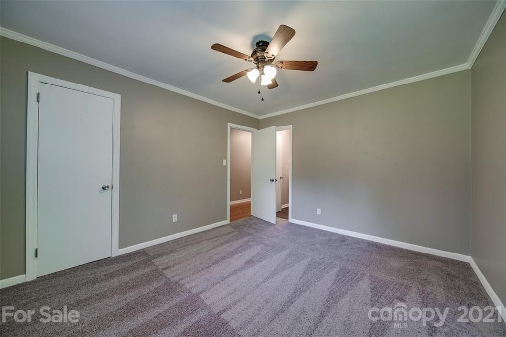 3802 Austin Road Monroe, NC 28112 - Photo 36 of 43 a view of an empty room with window and wooden floor
