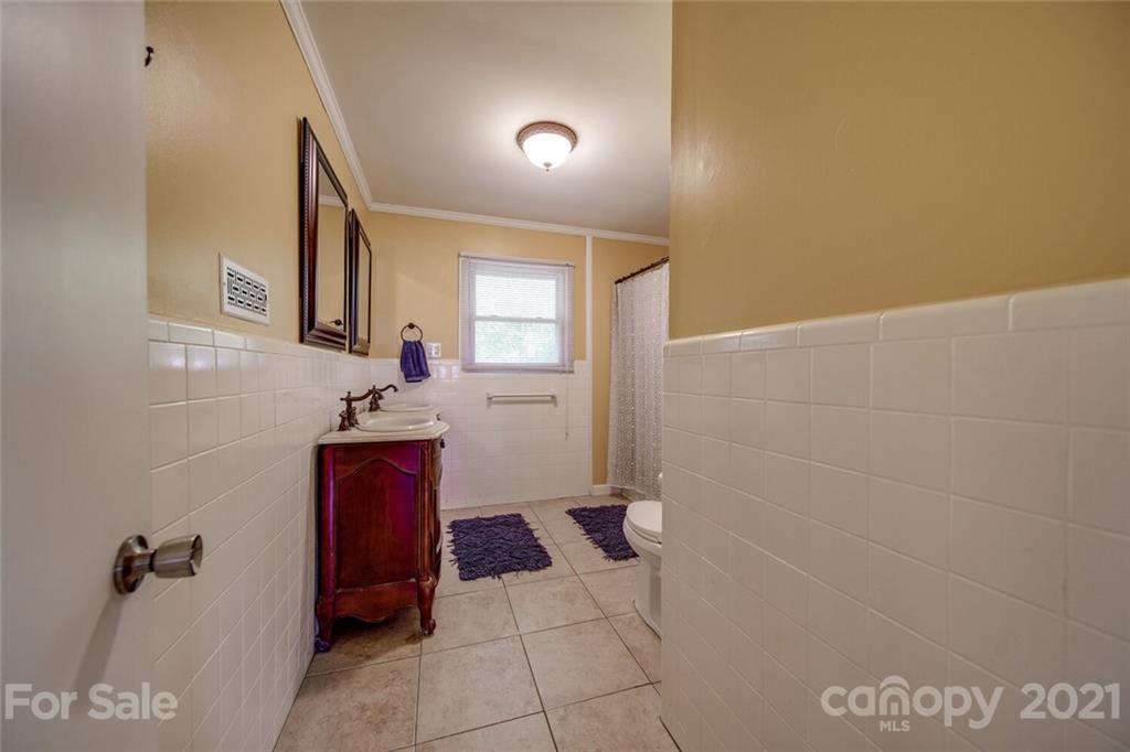3802 Austin Road Monroe, NC 28112 - Photo 39 of 43 a bathroom with a sink and a mirror