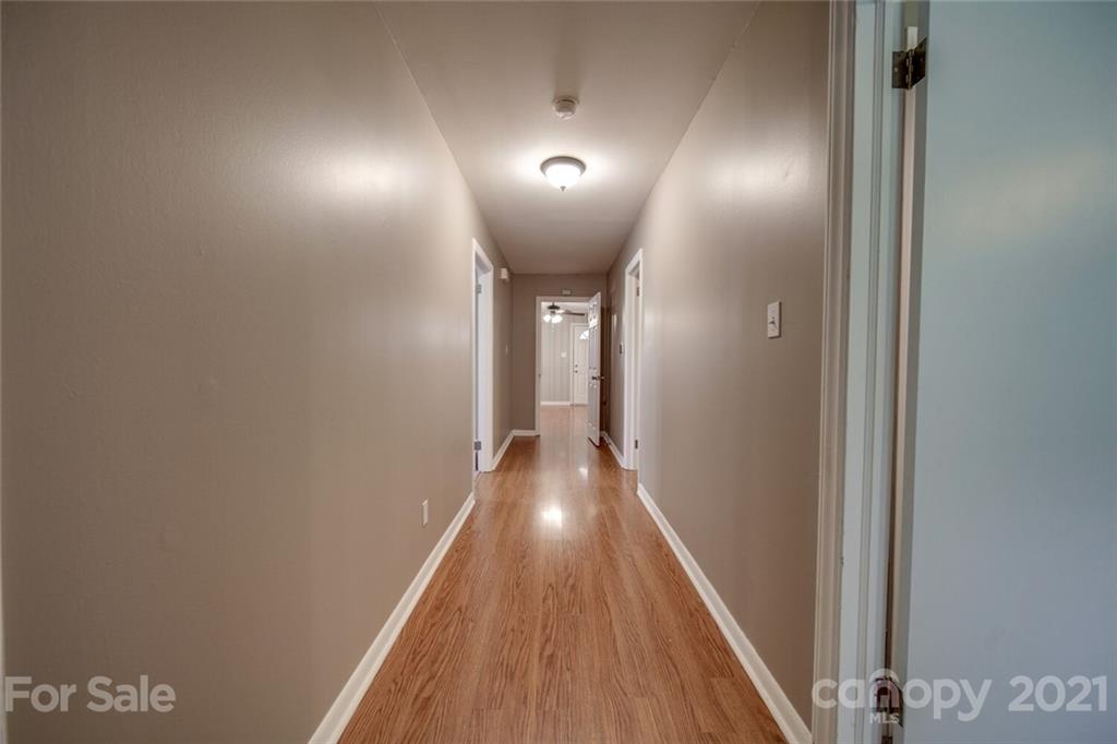 3802 Austin Road Monroe, NC 28112 - Photo 40 of 43 a view of a hallway with wooden floor