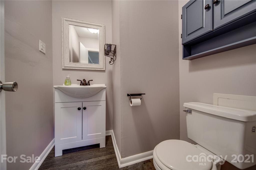 3802 Austin Road Monroe, NC 28112 - Photo 43 of 43 a white toilet sitting next to a bathroom sink