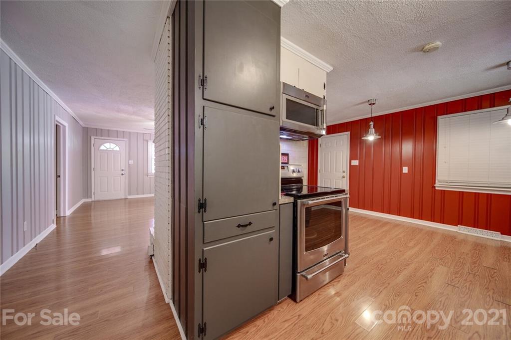 3802 Austin Road Monroe, NC 28112 - Photo 6 of 43 a view of a kitchen with a sink and an oven