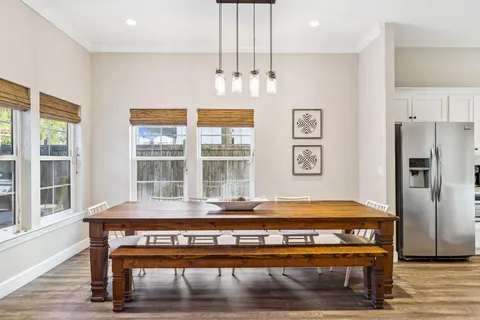 a living room with furniture ceiling fan and a fireplace