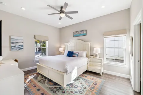 a bathroom with a sink vanity mirror toilet and bathtub