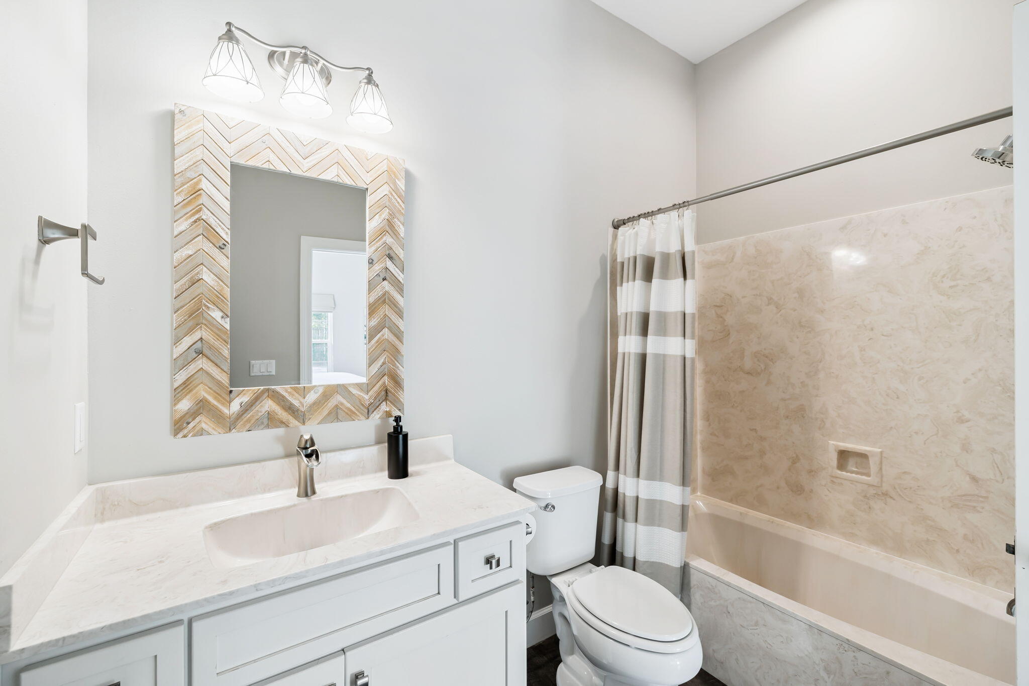 20 Sundance Court Miramar Beach, FL 32550 - Photo 28 of 53 a bathroom with a sink vanity mirror toilet and bathtub