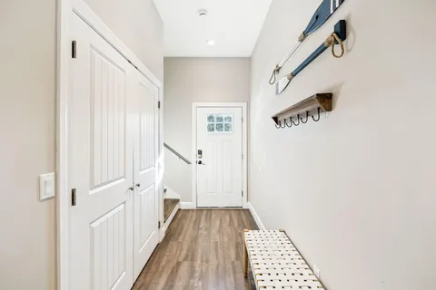 a kitchen with white cabinets and stainless steel appliances