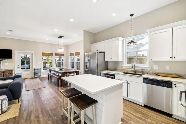 a view of kitchen with cabinets and wooden floor