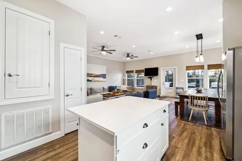a kitchen with a sink stove and refrigerator