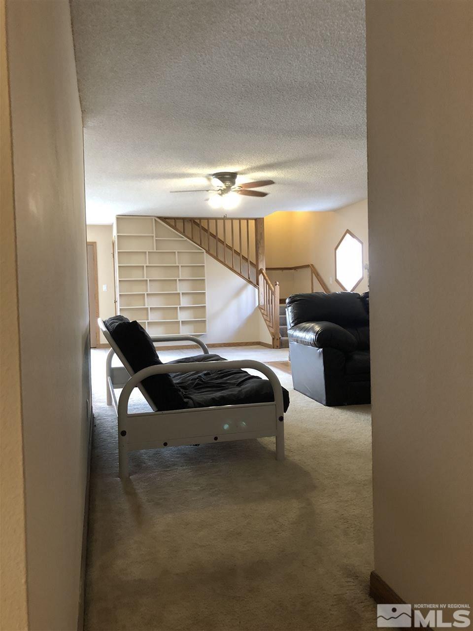 3351 Bryan Street Reno, NV 89503 - Photo 16 of 24 a bedroom with furniture and a lamp