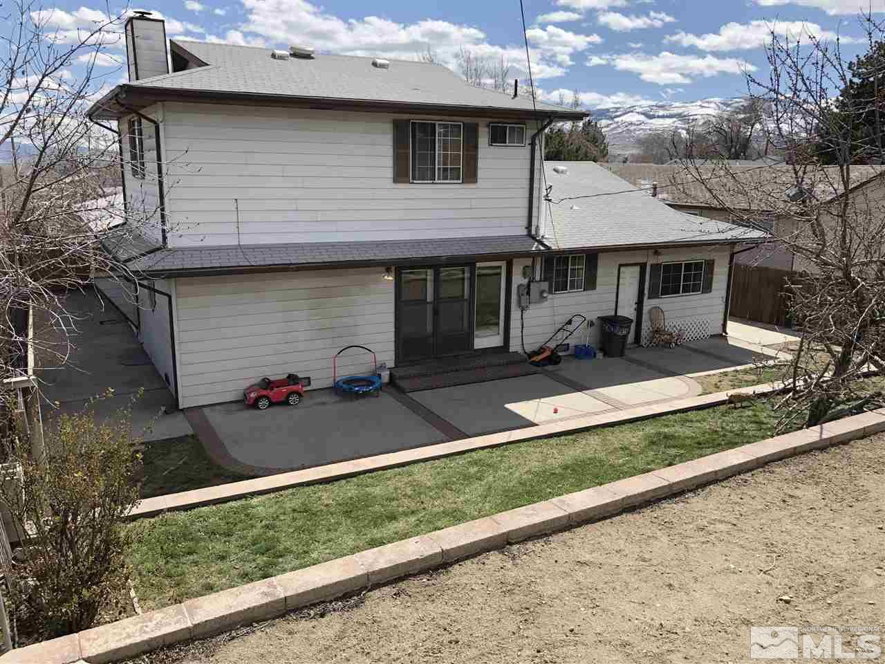 3351 Bryan Street Reno, NV 89503 - Photo 22 of 24 a front view of a house with a yard