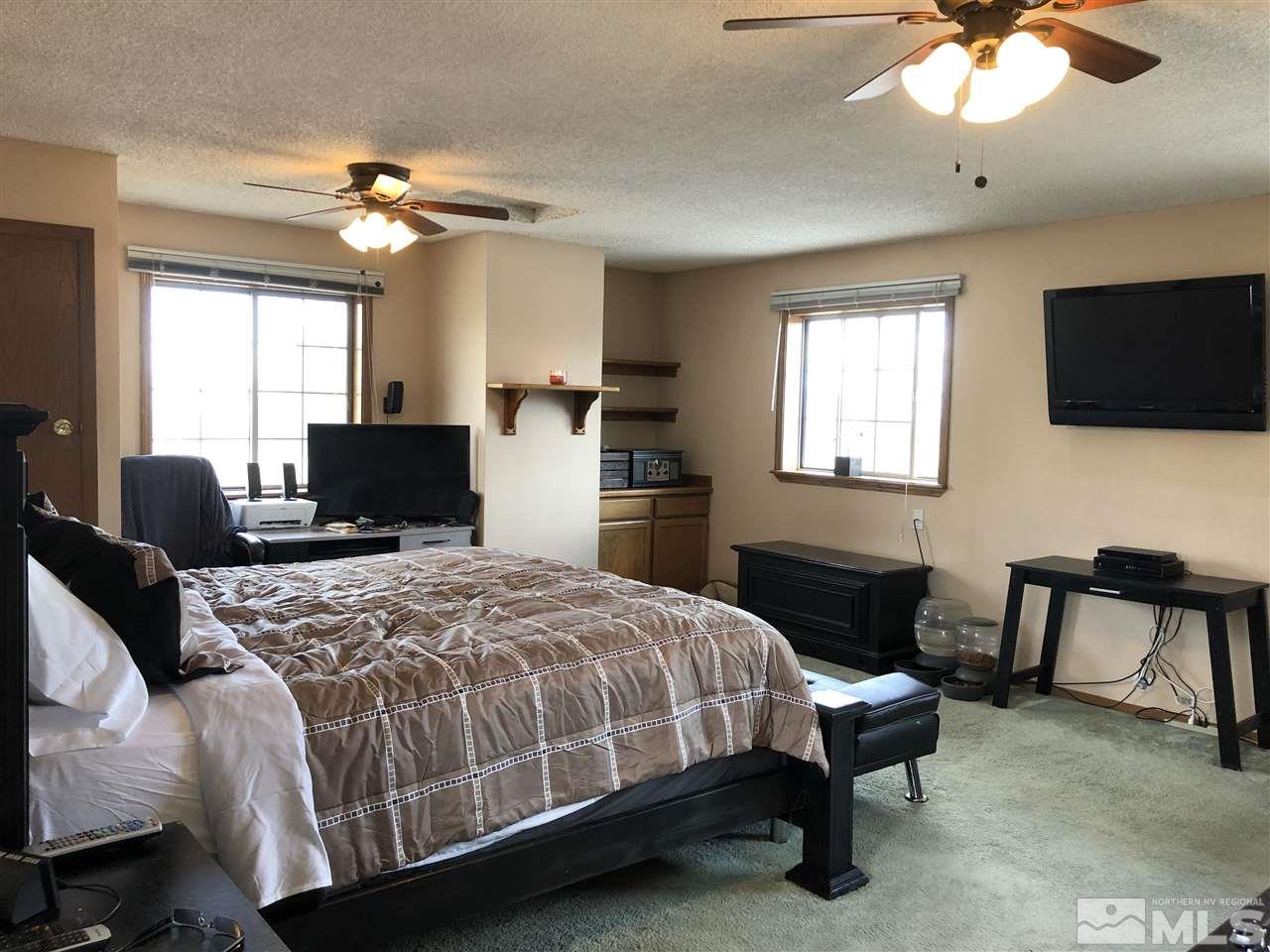 3351 Bryan Street Reno, NV 89503 - Photo 4 of 24 a bedroom with a bed and a television