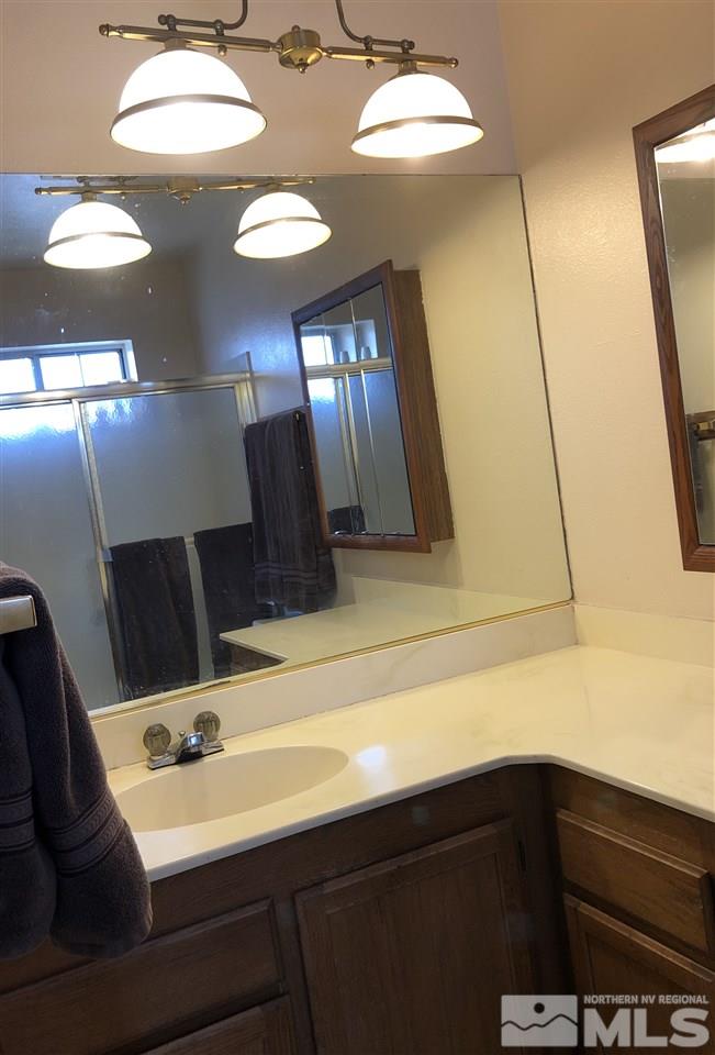 3351 Bryan Street Reno, NV 89503 - Photo 5 of 24 a bathroom with a sink and a mirror
