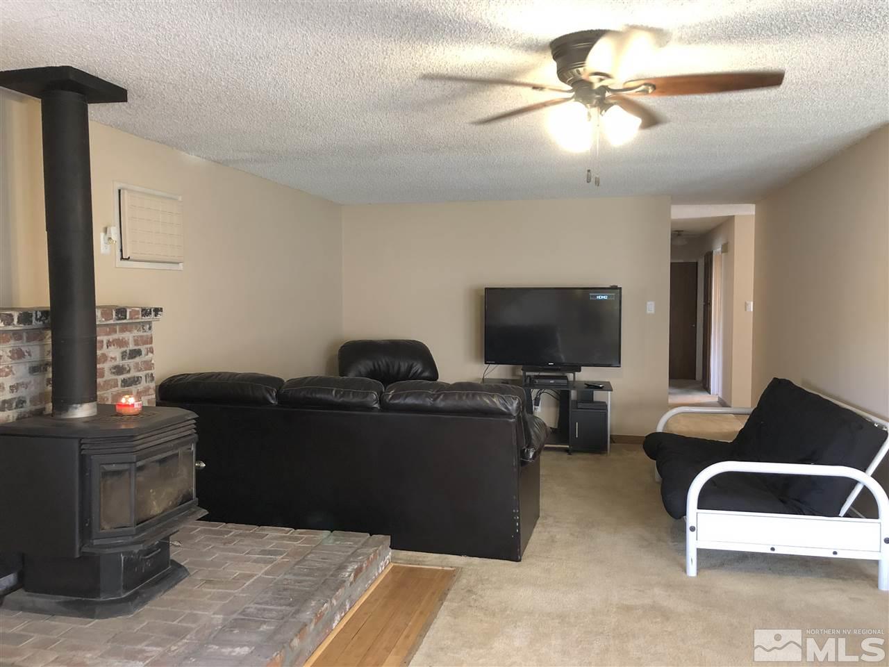 3351 Bryan Street Reno, NV 89503 - Photo 7 of 24 a living room with furniture and a flat screen tv