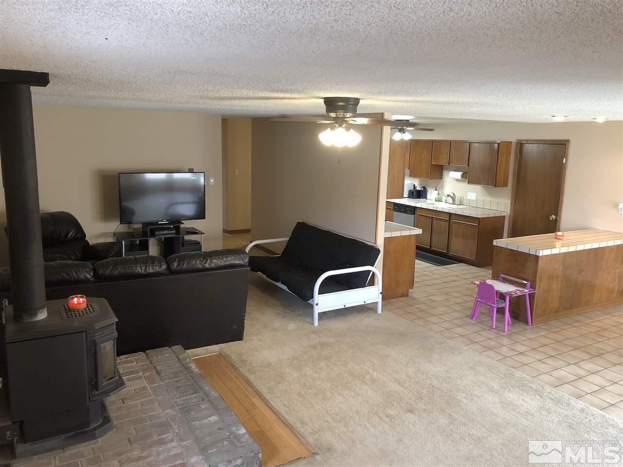 3351 Bryan Street Reno, NV 89503 - Photo 9 of 24 a living room with furniture and a wooden floor