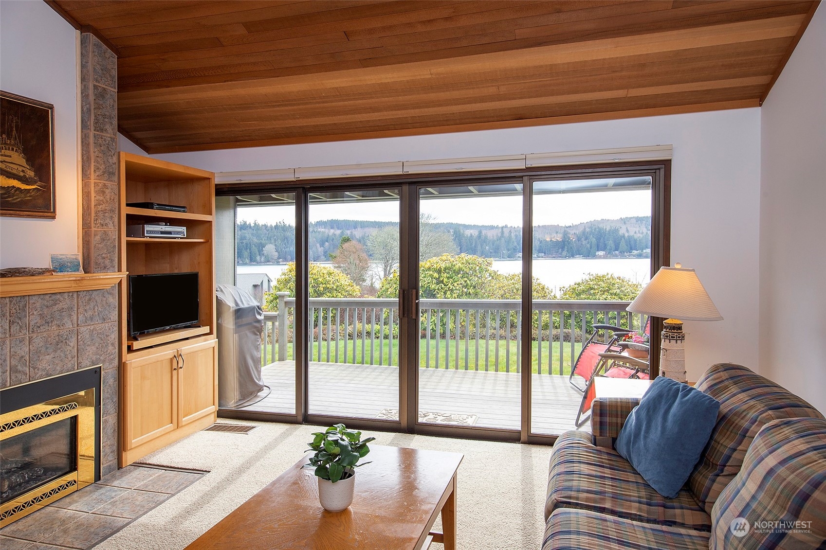 40 Olympic Way, Unit 9 Port Ludlow, WA 98365 - Photo 1 of 35 a living room with furniture and a fireplace
