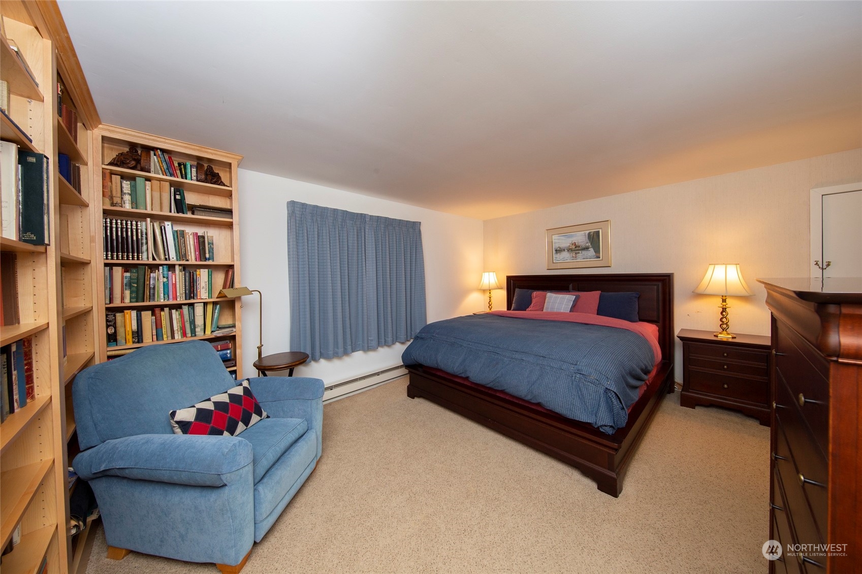 40 Olympic Way, Unit 9 Port Ludlow, WA 98365 - Photo 12 of 35 a bedroom with a bed and a book shelf