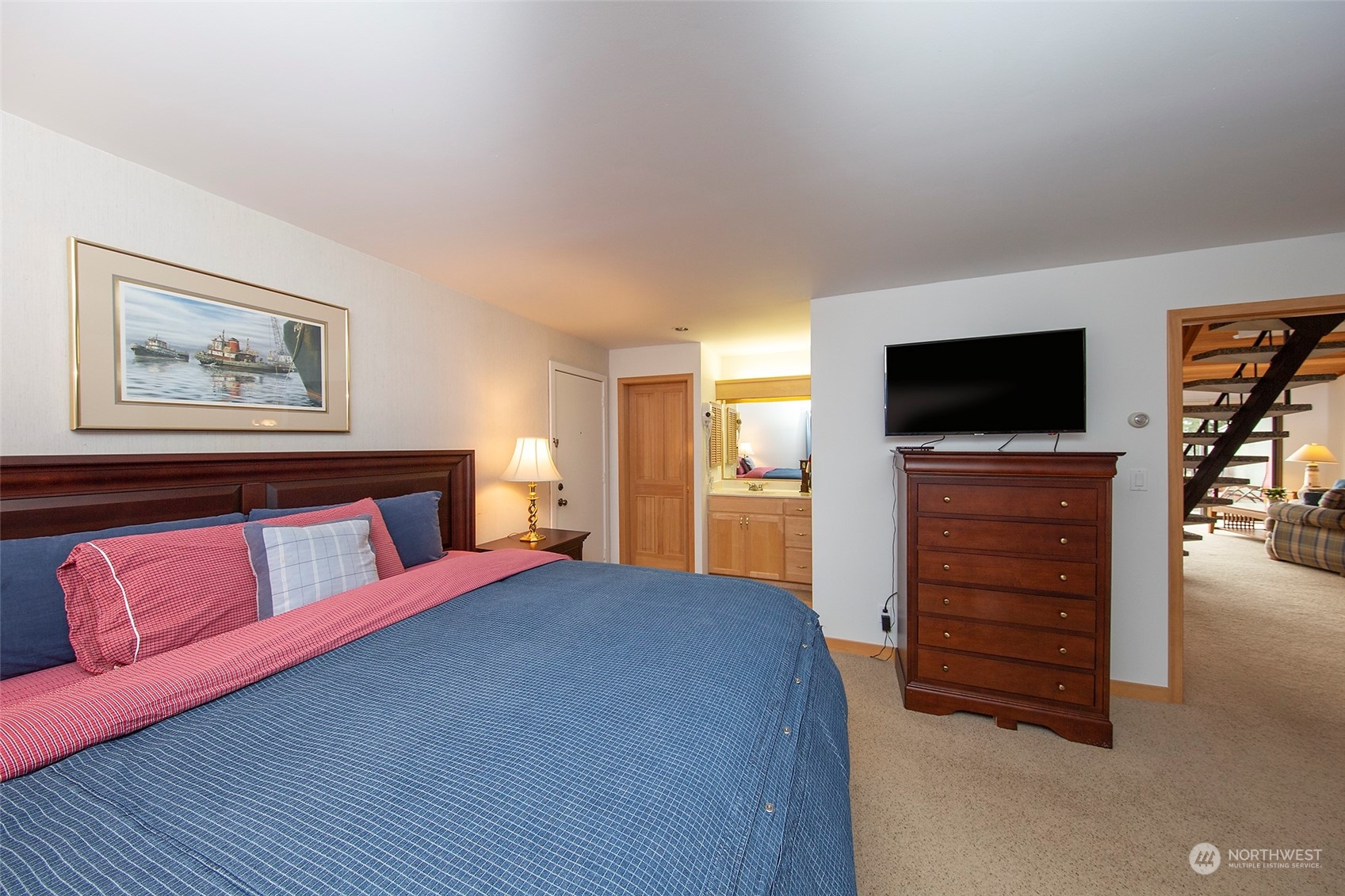 40 Olympic Way, Unit 9 Port Ludlow, WA 98365 - Photo 13 of 35 a bedroom with a bed and a television