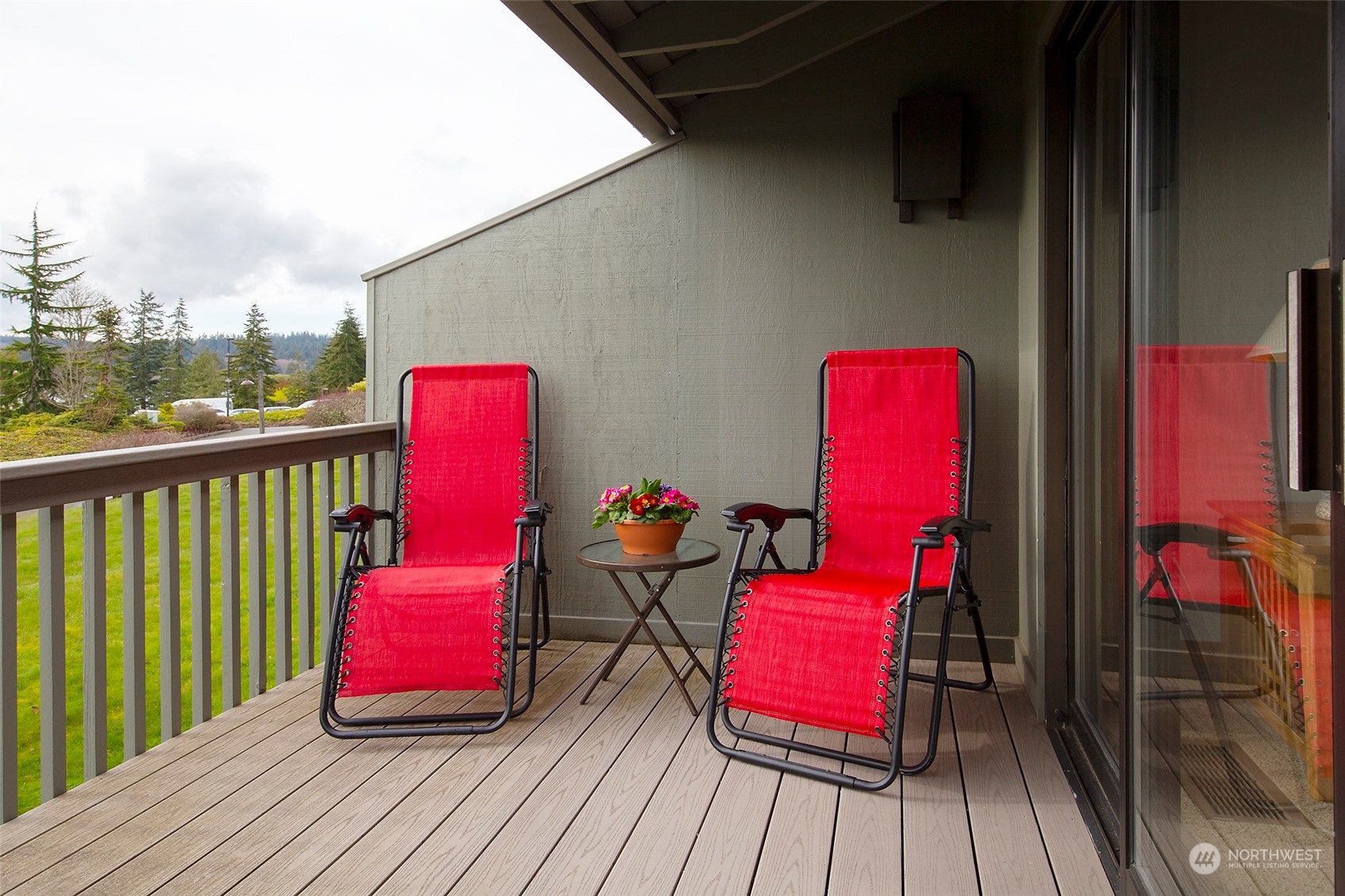 40 Olympic Way, Unit 9 Port Ludlow, WA 98365 - Photo 21 of 35 a view of a balcony with chairs and wooden floor
