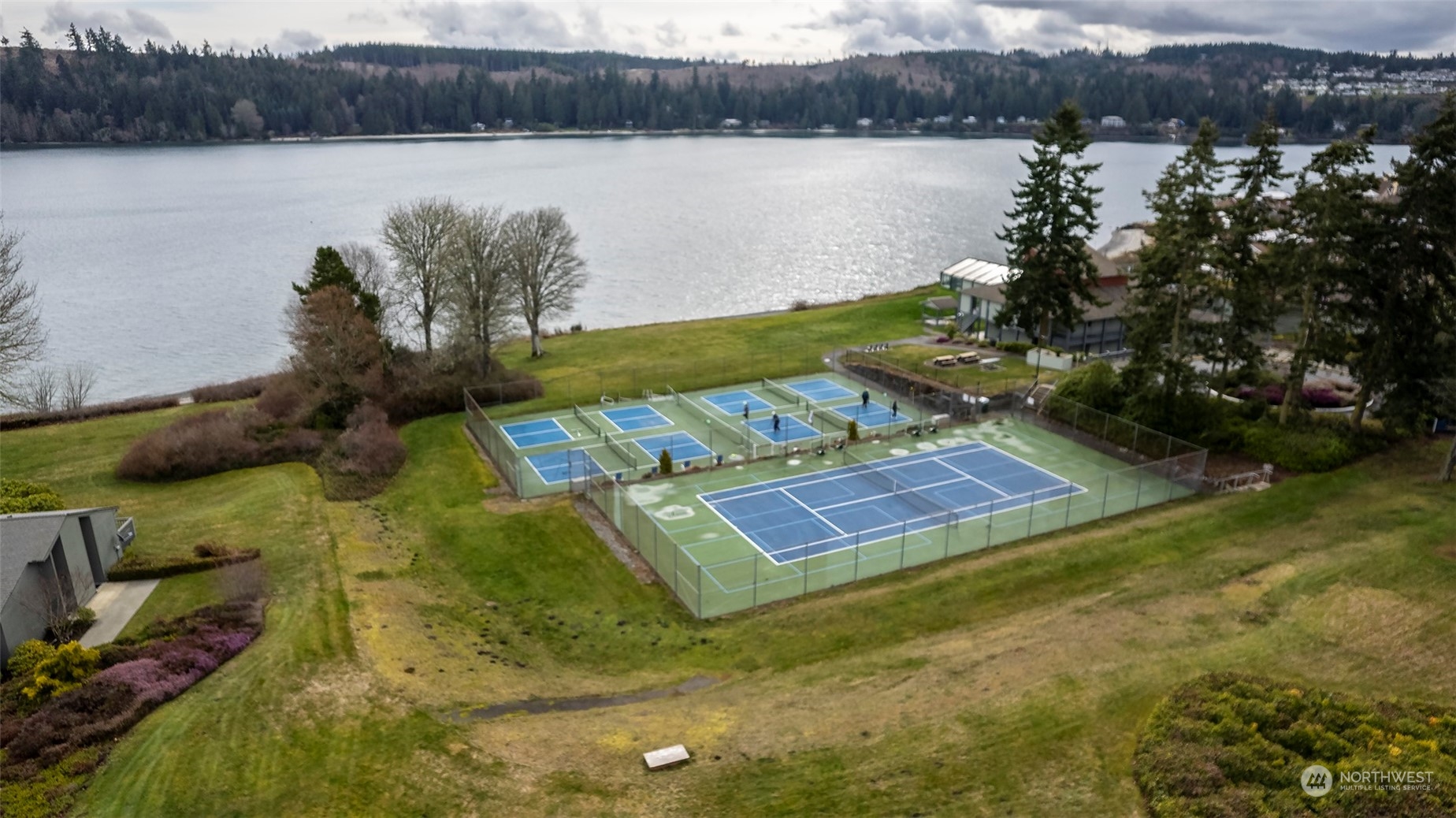 40 Olympic Way, Unit 9 Port Ludlow, WA 98365 - Photo 23 of 35 a view of a backyard with lake view and mountain view