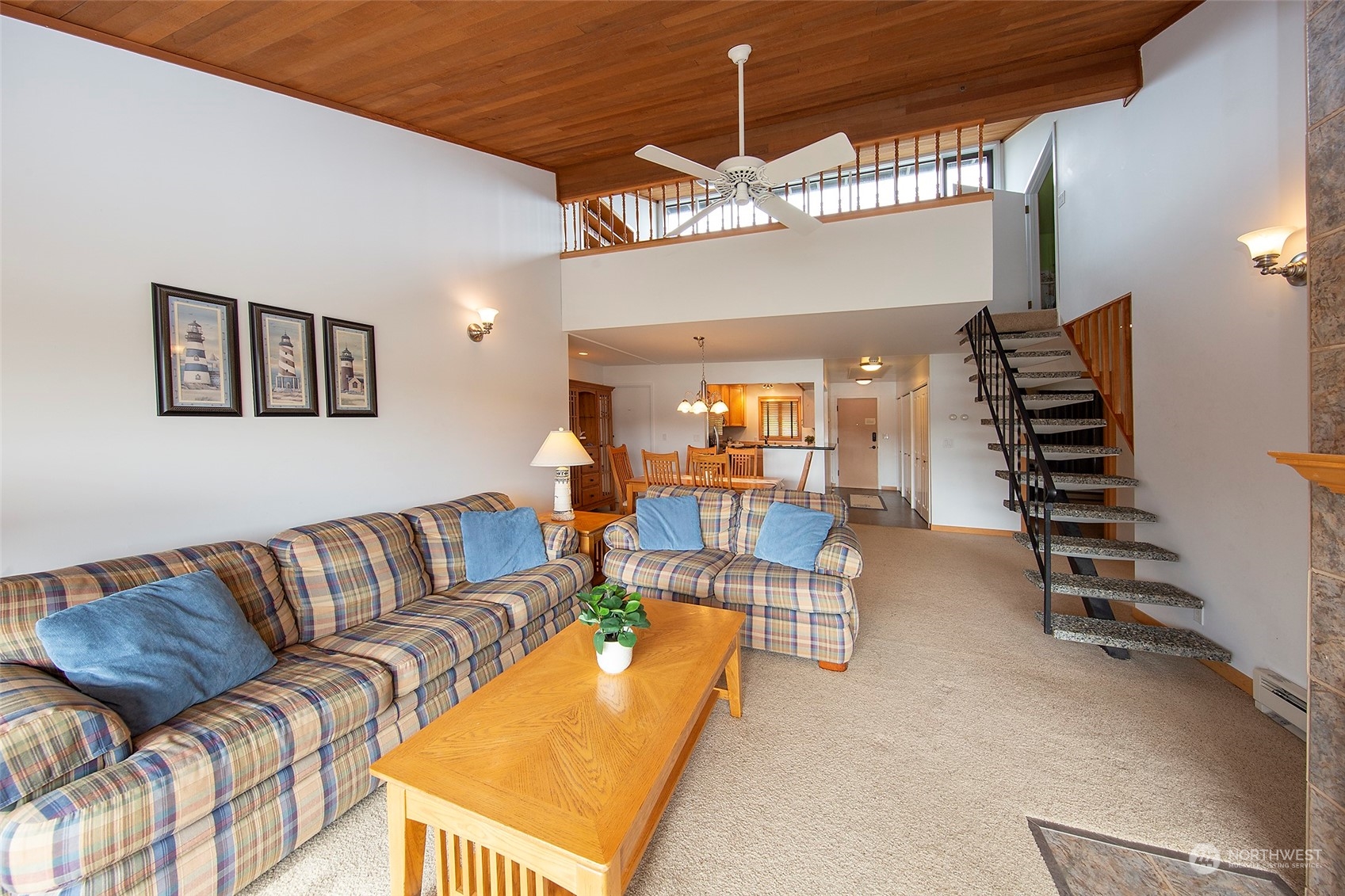 40 Olympic Way, Unit 9 Port Ludlow, WA 98365 - Photo 5 of 35 a living room with furniture a chandelier and a dining table