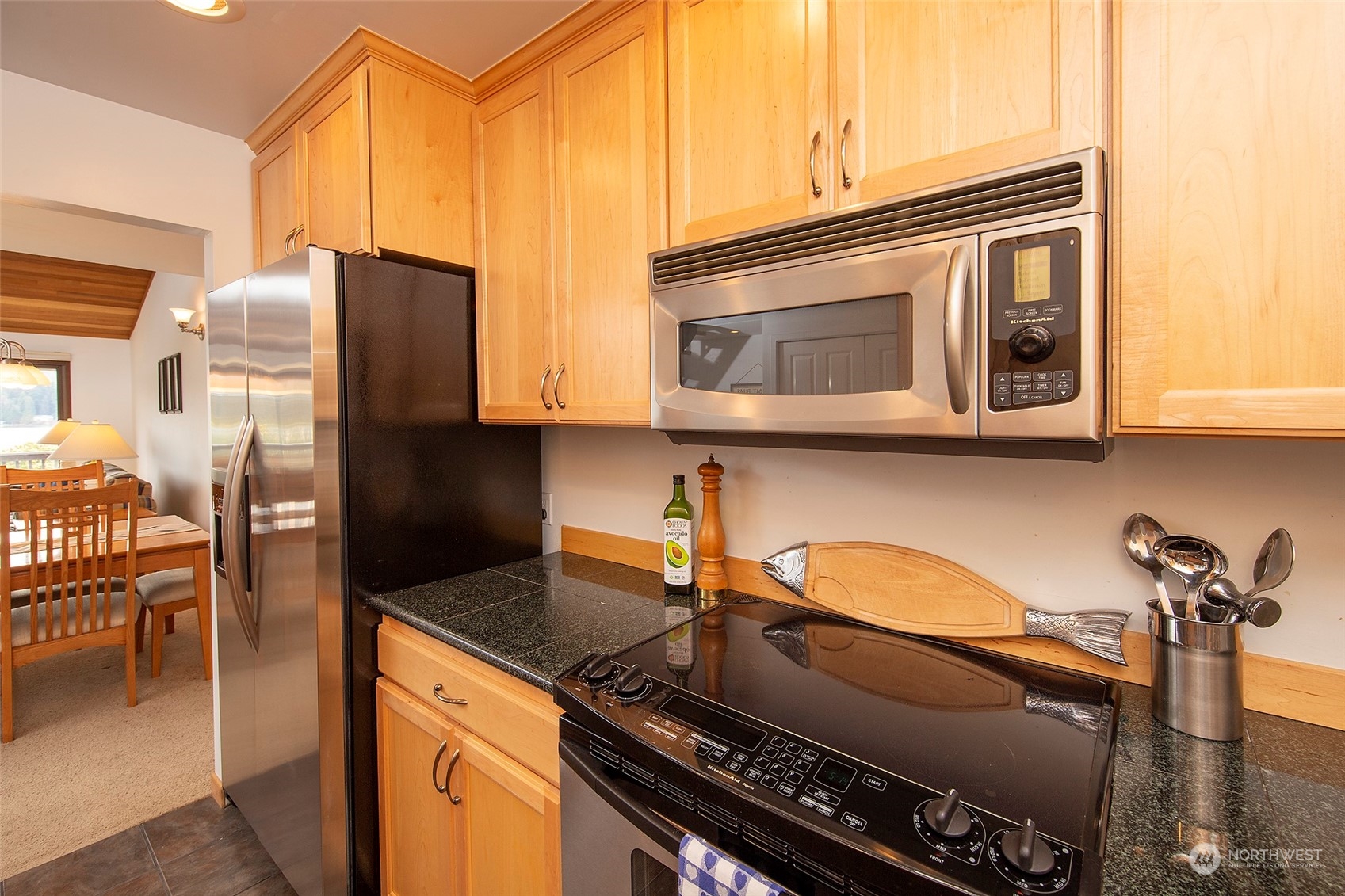 40 Olympic Way, Unit 9 Port Ludlow, WA 98365 - Photo 10 of 35 a kitchen with stainless steel appliances granite countertop a stove and a microwave