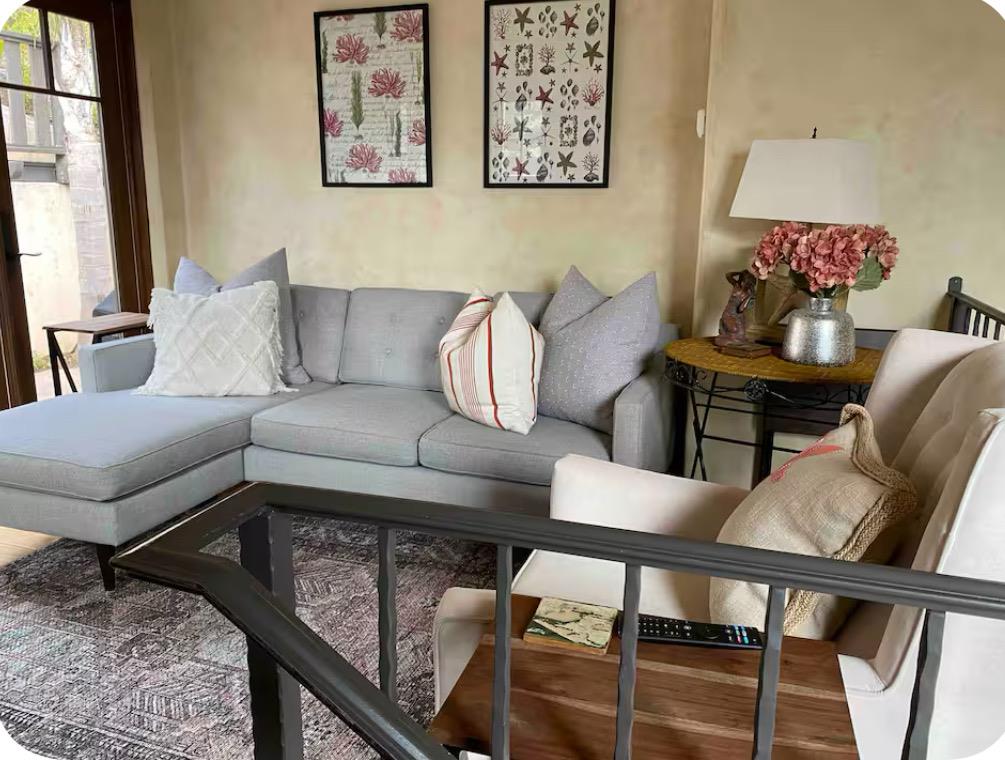 759 Rockaway Beach Avenue Pacifica, CA 94044 - Photo 11 of 20 a living room with furniture and wooden floor