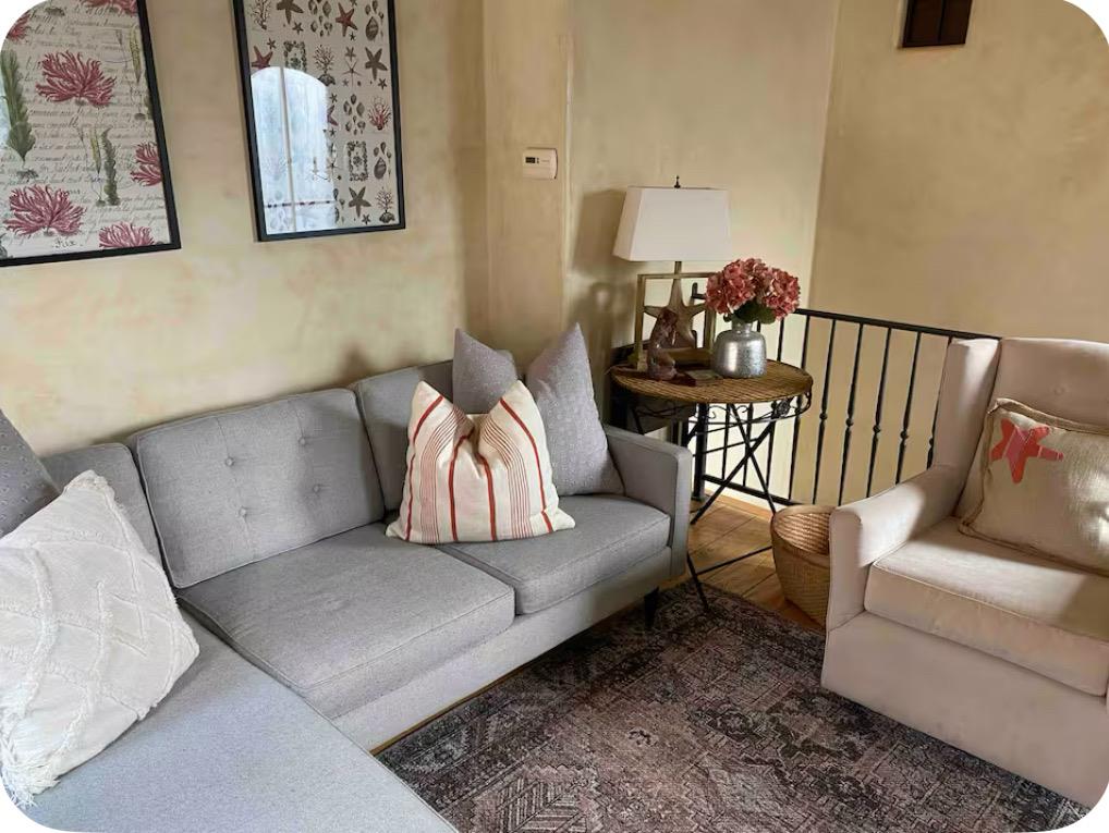 759 Rockaway Beach Avenue Pacifica, CA 94044 - Photo 12 of 20 a living room with furniture and wooden floor