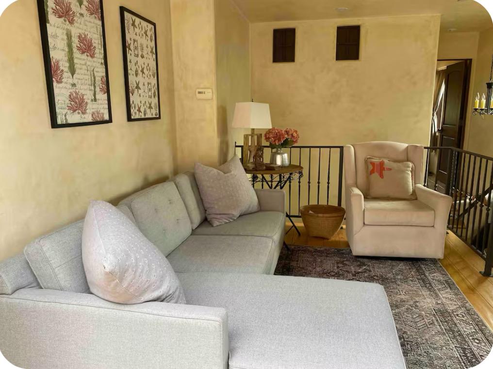 759 Rockaway Beach Avenue Pacifica, CA 94044 - Photo 13 of 20 a living room with furniture and a rug