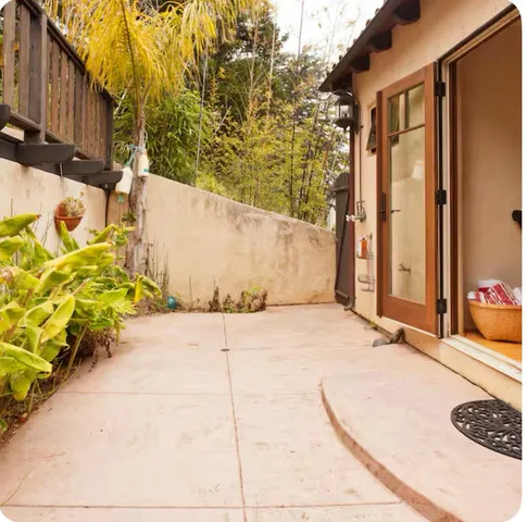a bed room with a bed and a large window