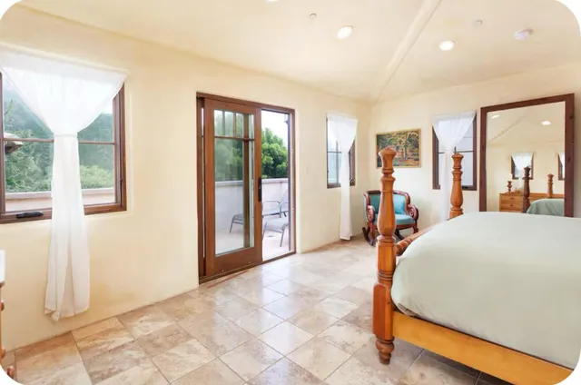 a bed room with a bed and a view